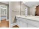 Bright bathroom featuring a white vanity with a mirror and view into an adjoining room at 512 Whilden St, Mount Pleasant, SC 29464