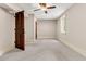 Cozy bedroom featuring a ceiling fan, light walls, and wood door at 512 Whilden St, Mount Pleasant, SC 29464