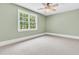 This bedroom features a ceiling fan and a window with natural light at 512 Whilden St, Mount Pleasant, SC 29464