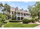 Beautiful home with inviting front porch, dormer windows, complemented by professionally landscaped yard at 512 Whilden St, Mount Pleasant, SC 29464