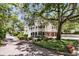 Gorgeous exterior featuring mature trees, lush landscaping, and a long driveway at 512 Whilden St, Mount Pleasant, SC 29464