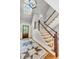 Elegant foyer with a staircase and light-filled entryway at 512 Whilden St, Mount Pleasant, SC 29464