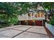 Spacious three-car garage with decorative doors, set in a well-maintained area surrounded by greenery at 512 Whilden St, Mount Pleasant, SC 29464