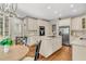 Well-appointed kitchen featuring stainless steel appliances, granite countertops, kitchen island, and hardwood floors at 512 Whilden St, Mount Pleasant, SC 29464
