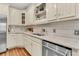 Stylish kitchen with stainless-steel appliances, granite countertops, custom cabinets, and hardwood floors at 512 Whilden St, Mount Pleasant, SC 29464