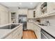 Spacious kitchen featuring stainless-steel appliances, granite countertops, custom cabinets, and hardwood floors at 512 Whilden St, Mount Pleasant, SC 29464