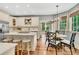 Open kitchen with island, breakfast bar, white cabinets, and stainless steel appliances at 512 Whilden St, Mount Pleasant, SC 29464