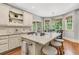 Well-lit kitchen with a kitchen island, cozy breakfast nook, and modern finishes at 512 Whilden St, Mount Pleasant, SC 29464