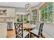 Charming breakfast nook with a round table, woven chairs, and bright windows at 512 Whilden St, Mount Pleasant, SC 29464