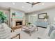 Inviting living room features a cozy brick fireplace and stylish coastal decor at 512 Whilden St, Mount Pleasant, SC 29464