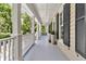 Spacious veranda featuring classic white columns, offering a charming outdoor living space with serene views at 512 Whilden St, Mount Pleasant, SC 29464