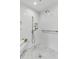 Elegant marble shower features a rain shower head, handheld wand, and built-in bench at 512 Whilden St, Mount Pleasant, SC 29464