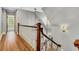 Hallway staircase with natural light and hardwood flooring at 512 Whilden St, Mount Pleasant, SC 29464