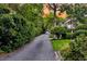 Picturesque street with lush greenery, showing a charming home with a inviting porch in the background at 512 Whilden St, Mount Pleasant, SC 29464