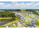 Aerial view of new construction neighborhood with beautiful pond and lots of green space in South Carolina at 513 Richfield Way, Summerville, SC 29486