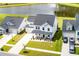Aerial view of a beautiful two-story home with a well-manicured lawn, landscaping, and a scenic pond at 513 Richfield Way, Summerville, SC 29486