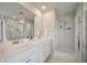Elegant bathroom featuring double sinks, a large mirror, and a walk-in shower at 513 Richfield Way, Summerville, SC 29486