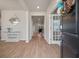 Inviting foyer with wood flooring, a modern mirror, a console table with decor, and a view into the home at 513 Richfield Way, Summerville, SC 29486