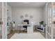 Cozy home office featuring a desk, comfortable chair, decorative wall art, shelving, and ample natural light at 513 Richfield Way, Summerville, SC 29486