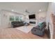 Cozy living room with a fireplace, large sectional couch, and view of the backyard at 513 Richfield Way, Summerville, SC 29486
