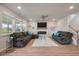 Bright living room with a fireplace, large windows, comfortable seating, and hardwood floors at 513 Richfield Way, Summerville, SC 29486