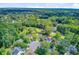 Aerial view of a leafy neighborhood with mature trees, beautiful homes, and a serene setting at 5406 E Crosland Ct, North Charleston, SC 29420