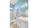 Bright bathroom features a shower-tub combo and a white vanity with ample storage and counter space at 5406 E Crosland Ct, North Charleston, SC 29420
