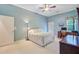 Well-lit bedroom with ceiling fan, closet, and private access to the backyard at 5406 E Crosland Ct, North Charleston, SC 29420