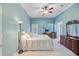 Comfortable primary bedroom with plush carpet, a ceiling fan, and ample natural light at 5406 E Crosland Ct, North Charleston, SC 29420