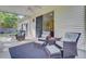 Inviting covered patio with comfortable seating, perfect for outdoor enjoyment and relaxation at 5406 E Crosland Ct, North Charleston, SC 29420