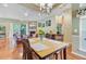 Inviting dining room with hardwood floors, and an open view of the comfortable living area at 5406 E Crosland Ct, North Charleston, SC 29420
