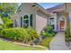 Close-up of the house's front entrance, accented with lush landscaping and decorative lighting at 5406 E Crosland Ct, North Charleston, SC 29420