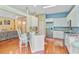 Kitchen view showcasing counter seating, stainless steel appliances, and open floorplan at 5406 E Crosland Ct, North Charleston, SC 29420