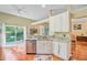 Kitchen area with stainless dishwasher, granite countertops and backyard view at 5406 E Crosland Ct, North Charleston, SC 29420