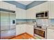 Kitchen featuring stainless steel appliances, granite countertops, and white cabinets at 5406 E Crosland Ct, North Charleston, SC 29420