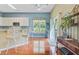 Eat-in kitchen with white cabinetry, stainless appliances, and breakfast bar seating at 5406 E Crosland Ct, North Charleston, SC 29420