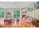 Spacious living room with a fireplace, hardwood floors, and a comfortable seating arrangement at 5406 E Crosland Ct, North Charleston, SC 29420