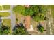 An aerial view of a charming home with a well-manicured lawn and surrounded by lush trees at 565 Estates Dr, Walterboro, SC 29488
