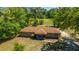 Aerial view of cozy home featuring a brick exterior and a well-maintained front lawn at 565 Estates Dr, Walterboro, SC 29488