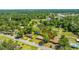Looking down, an arrow guides the eye to a dwelling, nestled between green treetops in a peaceful, wooded suburb at 565 Estates Dr, Walterboro, SC 29488