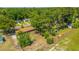 Aerial shot of a charming home surrounded by lush greenery, featuring a manicured lawn at 565 Estates Dr, Walterboro, SC 29488