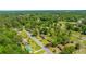 Overhead, a leafy neighborhood showcases homes interspersed with mature trees, blending suburban living with natural beauty at 565 Estates Dr, Walterboro, SC 29488