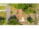 Aerial view of a charming home featuring a well-kept yard and driveway, surrounded by trees at 565 Estates Dr, Walterboro, SC 29488