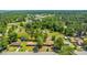 Overhead, a neighborhood is set among lush trees; mature greenery offers both beauty and a sense of quiet suburban living at 565 Estates Dr, Walterboro, SC 29488