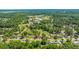 Aerial view showcasing homes in a wooded area, close to town amenities and recreation at 565 Estates Dr, Walterboro, SC 29488