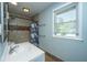Well-lit bathroom features a sink, toilet, and shower with decorative curtain at 565 Estates Dr, Walterboro, SC 29488