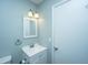 Cozy bathroom with white vanity, updated lighting, and a matching towel rack for convenience at 565 Estates Dr, Walterboro, SC 29488