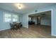 This dining area features an open concept with beautiful wood flooring and lots of natural light at 565 Estates Dr, Walterboro, SC 29488