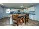 Kitchen with an island and seating, stainless steel appliances, and lots of countertop space at 565 Estates Dr, Walterboro, SC 29488
