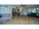 Cozy living room with wood-look flooring and an open layout to the kitchen at 565 Estates Dr, Walterboro, SC 29488